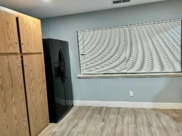 a view of an empty room with a chandelier