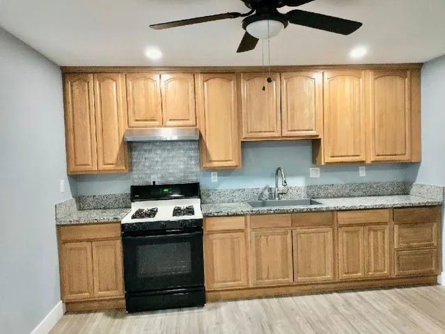 an empty room with wooden floor