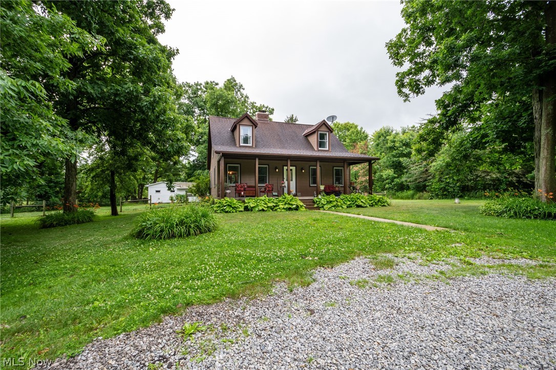14027 Mayfield Road Huntsburg, OH 44046 - Photo 50 of 50 Two-story residence with a covered front porch and dormer windows