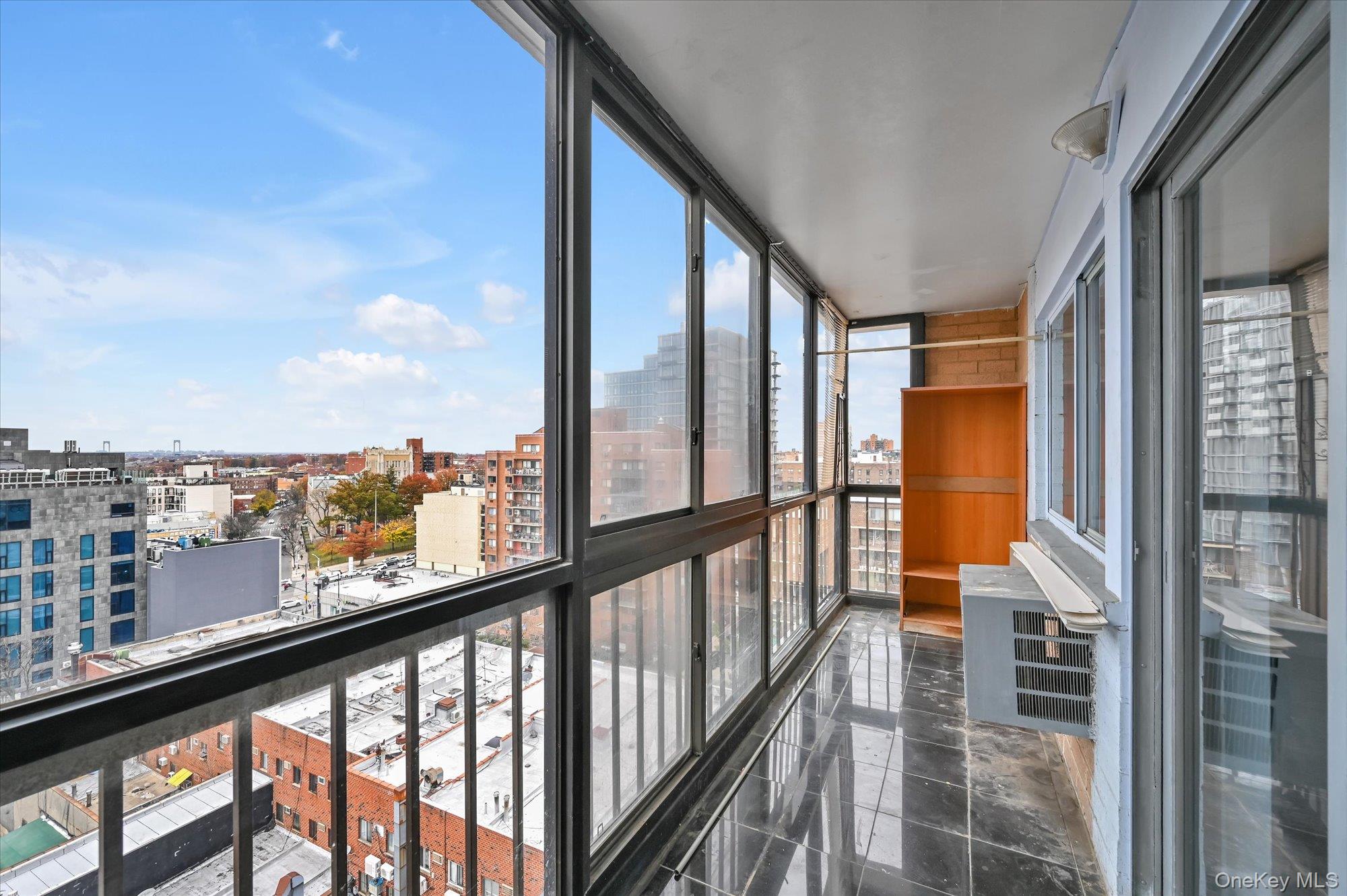 136-75 37th Avenue, Unit PH B Queens, NY 11354 - Photo 10 of 17 a view of city from a balcony