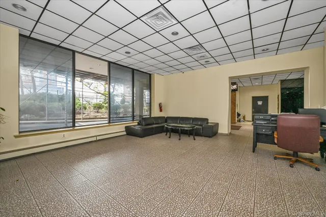 a view of an empty room and a window