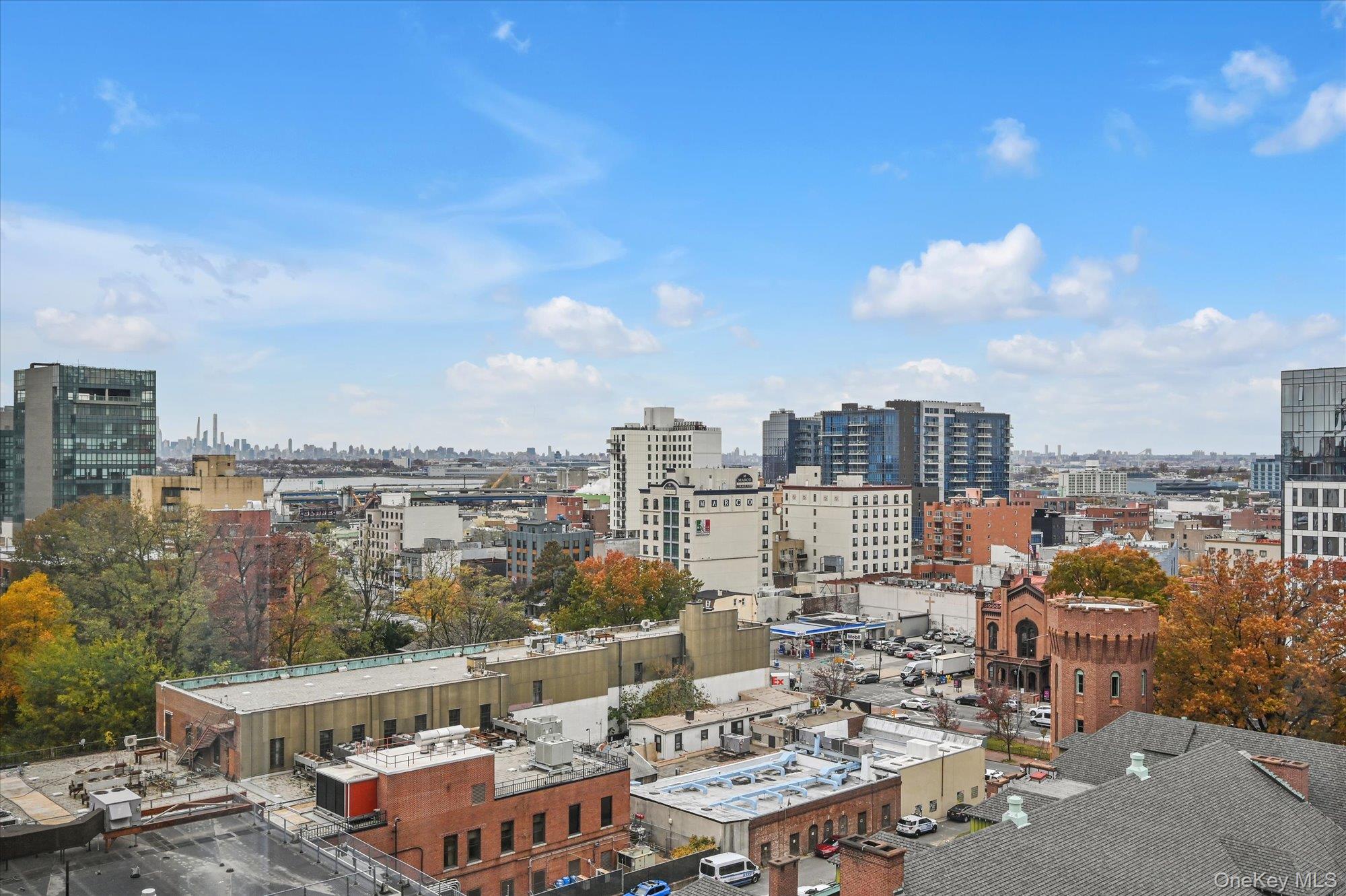 136-75 37th Avenue, Unit PH B Queens, NY 11354 - Photo 15 of 17 a view of city and a lake