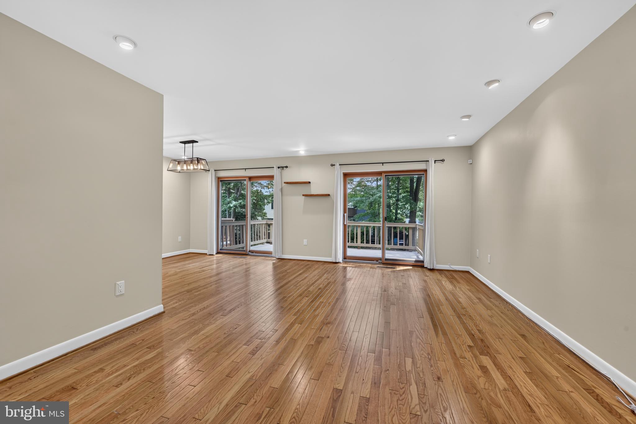 2031 Sarazen Place Reston, VA 20191 - Photo 4 of 27 Spacious Living Room with Two Sliding Glass Doors