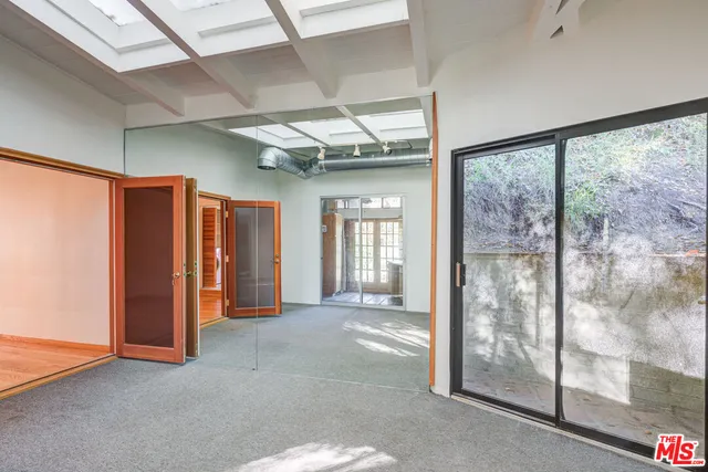 a kitchen with granite countertop white cabinets stainless steel appliances and a sink