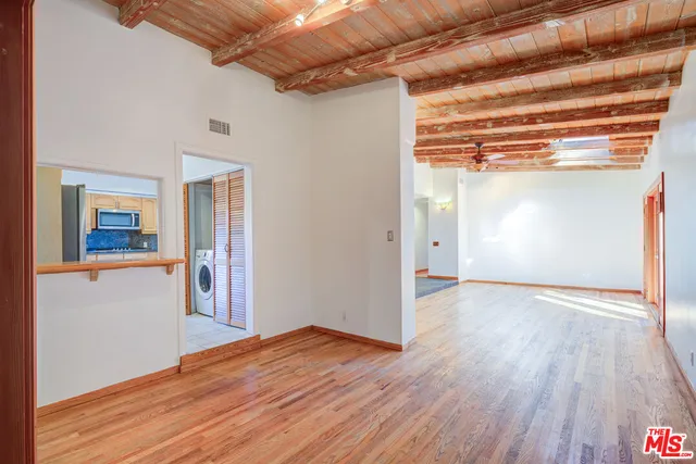 a kitchen with a sink and large window