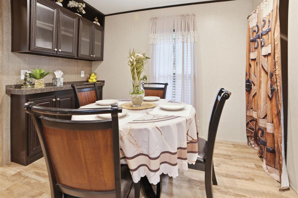 127 Almond Road Minden, LA 71055 - Photo 8 of 25 a dining room with furniture and wooden floor