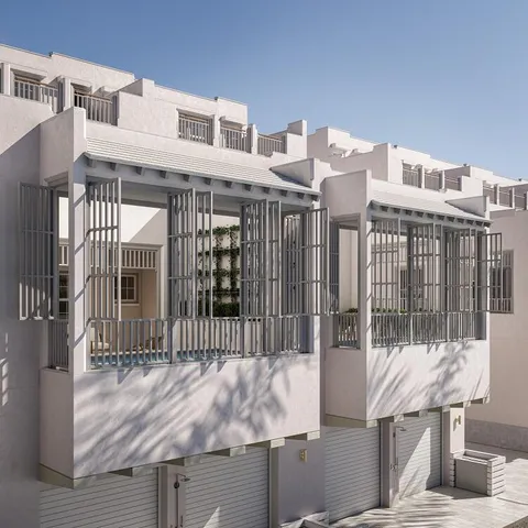 a front view of a house with wooden fence