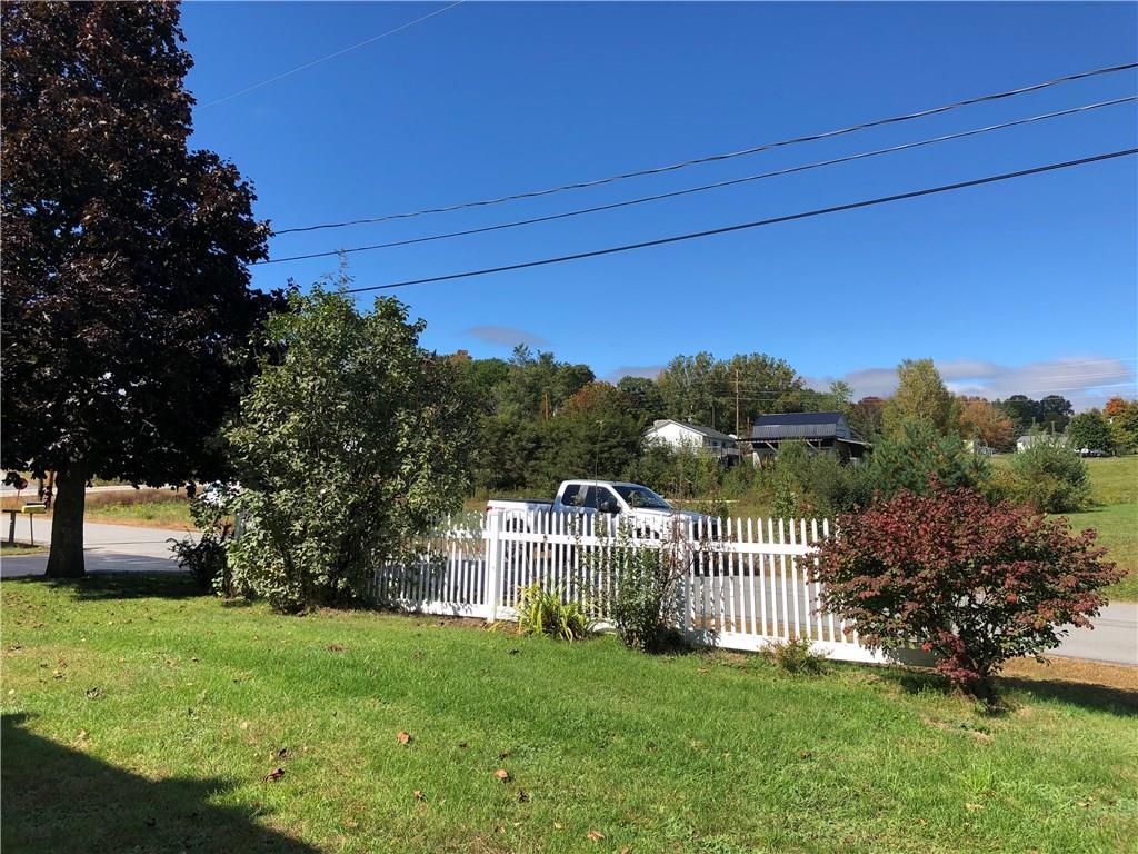 3 Allen Street Jay, ME 04239 - Photo 11 of 32 Front yard with perennial shrubs and...