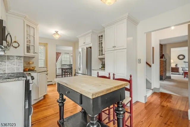 a very nice looking kitchen with a table and chairs