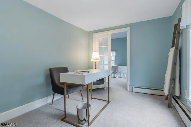 a view of a workspace with furniture