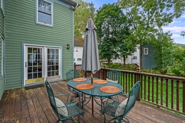 a balcony with table and chairs