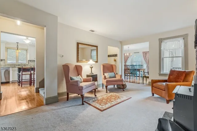 a living room with furniture and a table