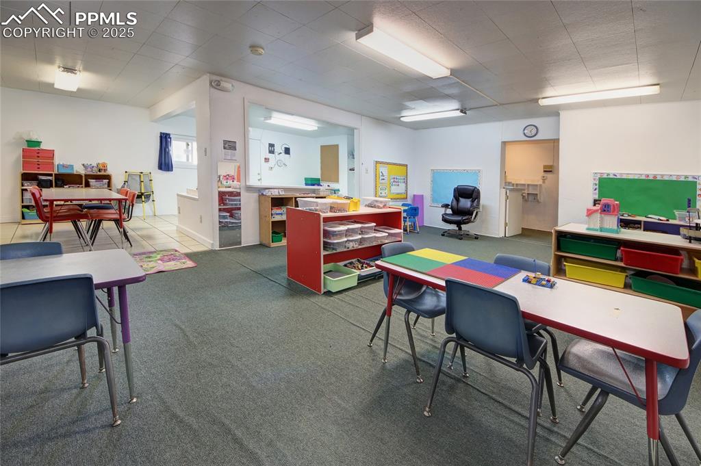 1015 West Cheyenne Road Colorado Springs, CO 80906 - Photo 14 of 33 a room with furniture a rug kitchen view and a chair