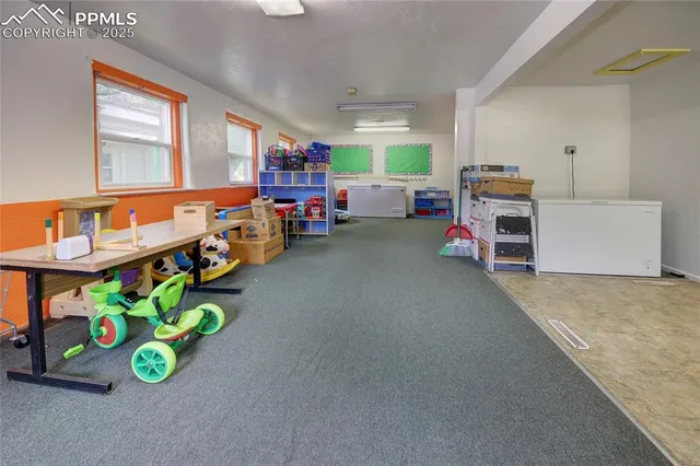 a storage room with lots of furniture and clutter