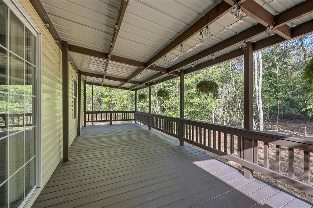 269 Southwest Backwoods Glen Fort White, FL 32038 - Photo 25 of 31 a view of a balcony with wooden floor