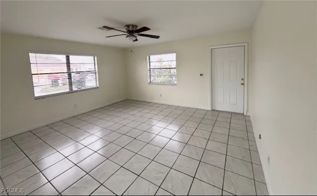 a view of an empty room and window
