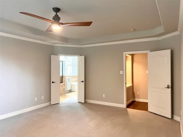 a bathroom with a tub sink shower and mirror