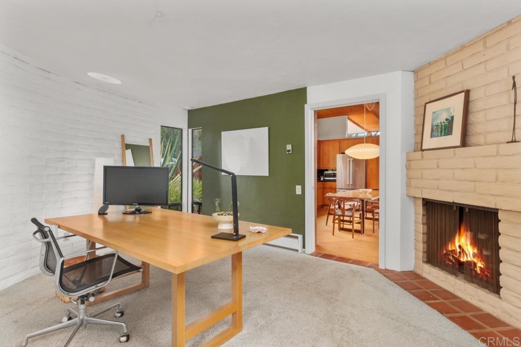 3533 Dove Hollow Road Encinitas, CA 92024 - Photo 12 of 32 a workspace with furniture and fireplace