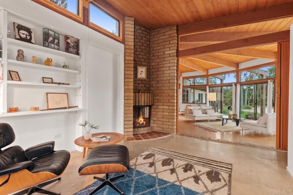 3533 Dove Hollow Road Encinitas, CA 92024 - Photo 14 of 32 a living room with furniture cabinets and a window