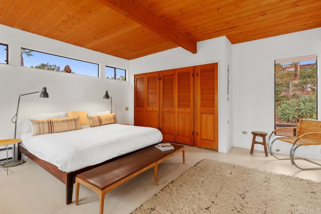 3533 Dove Hollow Road Encinitas, CA 92024 - Photo 17 of 32 a bedroom with a bed and furniture