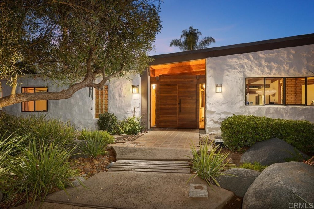 3533 Dove Hollow Road Encinitas, CA 92024 - Photo 2 of 32 a front view of a house with a yard