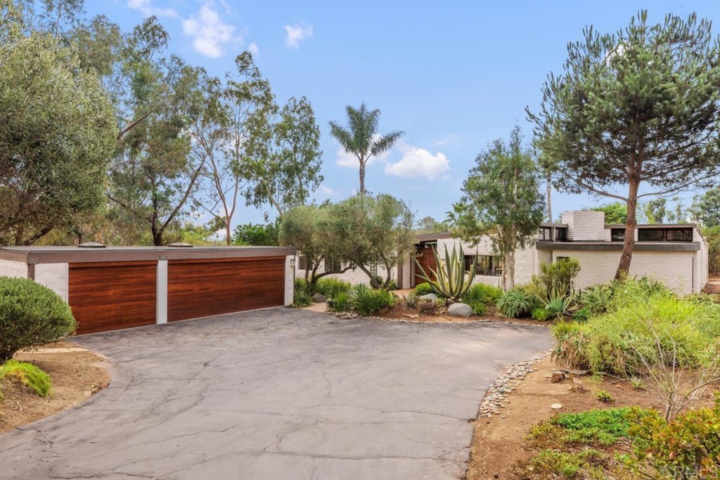 3533 Dove Hollow Road Encinitas, CA 92024 - Photo 24 of 32 a view of a garden with trees