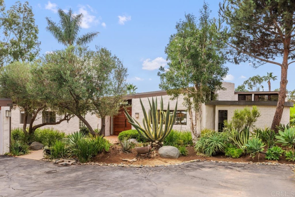 3533 Dove Hollow Road Encinitas, CA 92024 - Photo 25 of 32 a front view of a house with a garden