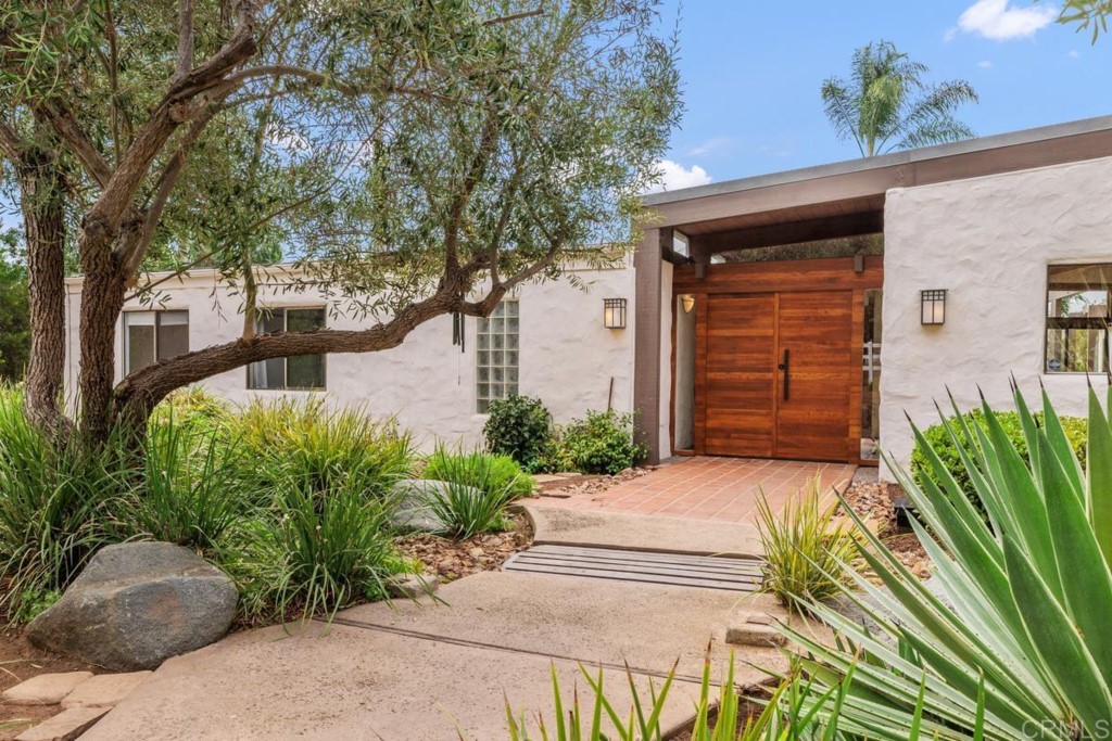3533 Dove Hollow Road Encinitas, CA 92024 - Photo 26 of 32 a front view of a house with a yard