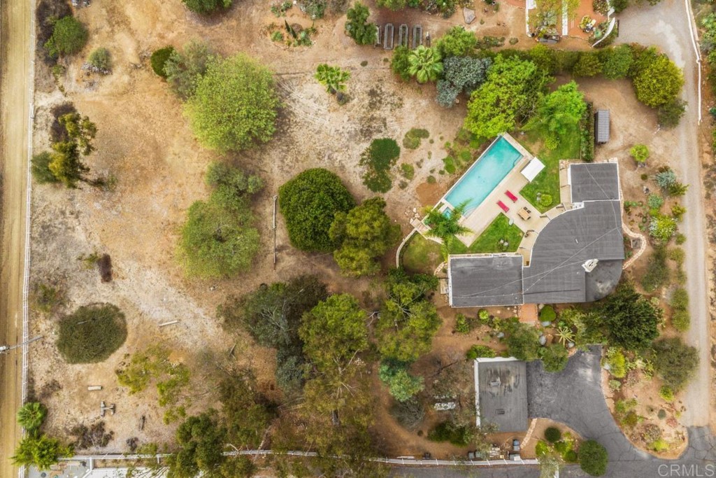 3533 Dove Hollow Road Encinitas, CA 92024 - Photo 30 of 32 an aerial view of a house with swimming pool and large trees