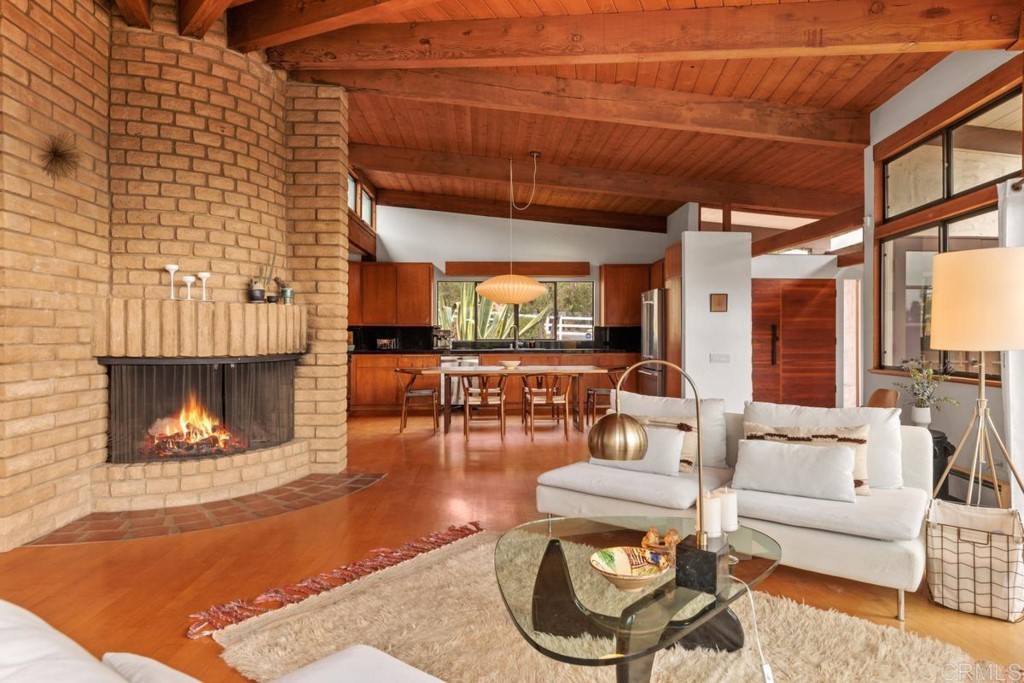 3533 Dove Hollow Road Encinitas, CA 92024 - Photo 8 of 32 a living room with furniture and a fireplace