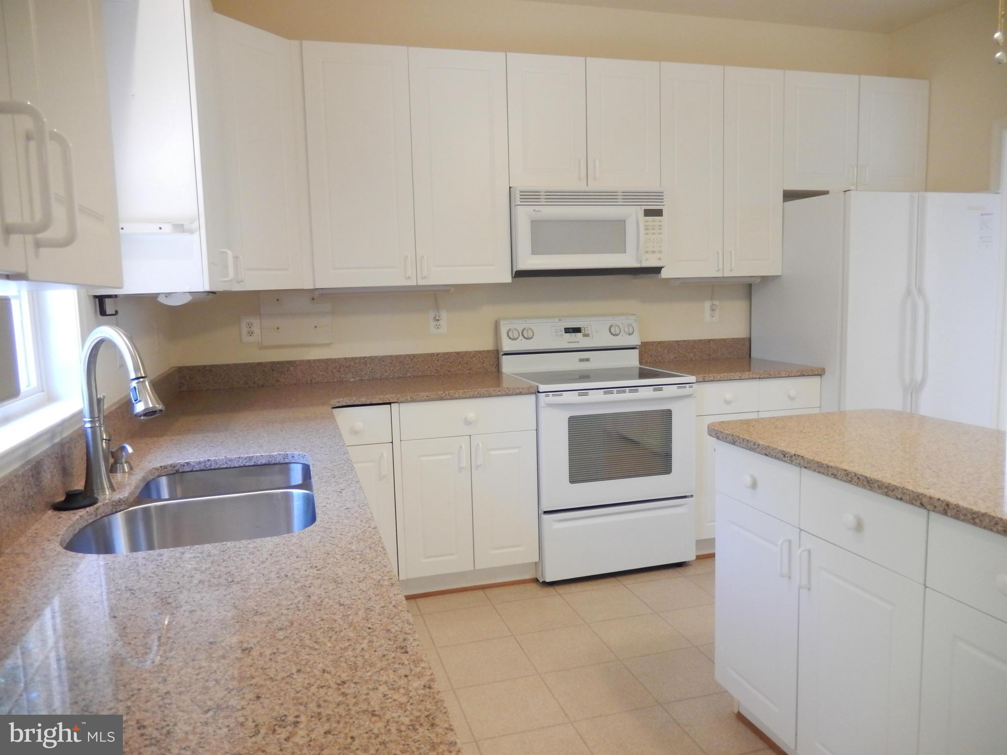 2564 Bear Den Road Frederick, MD 21701 - Photo 9 of 30 White Cabinets, Silestone (Quartz) Countertops.