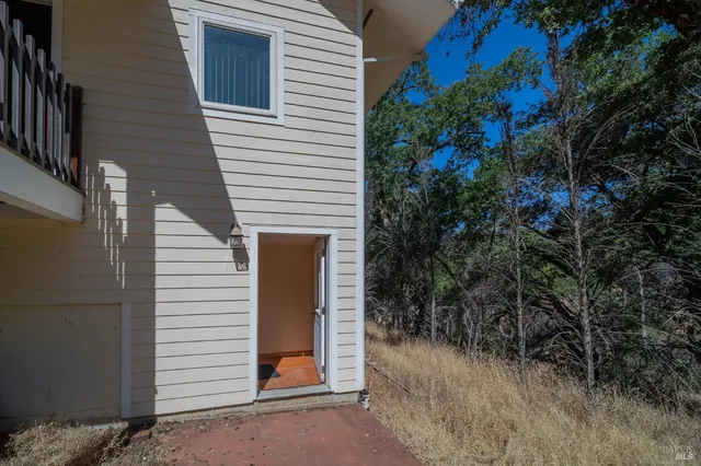 a view of a house with a tree