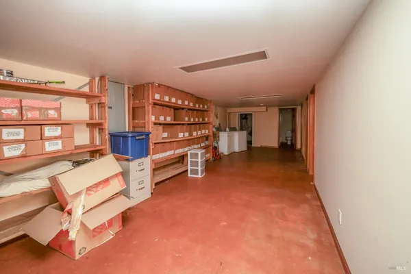 a view of an empty room with stairs