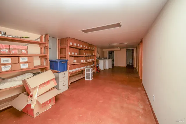 a view of an empty room with stairs