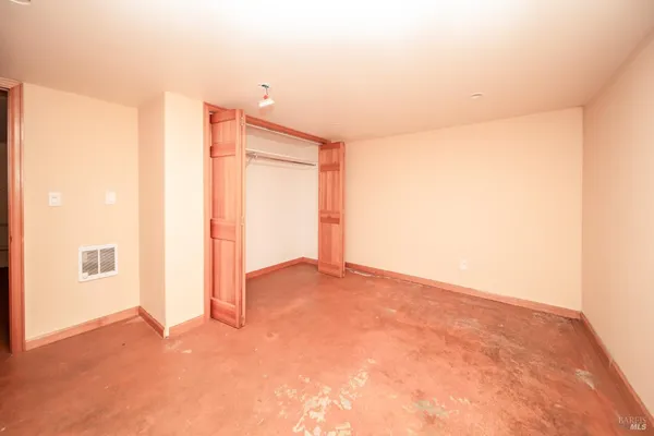 a view of storage and utility room with washing machine