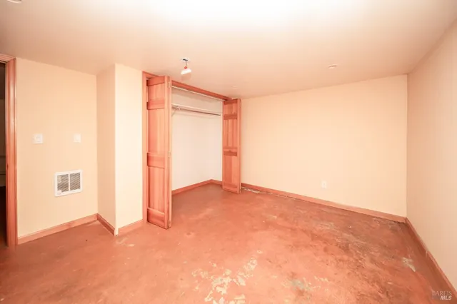 a view of storage and utility room with washing machine