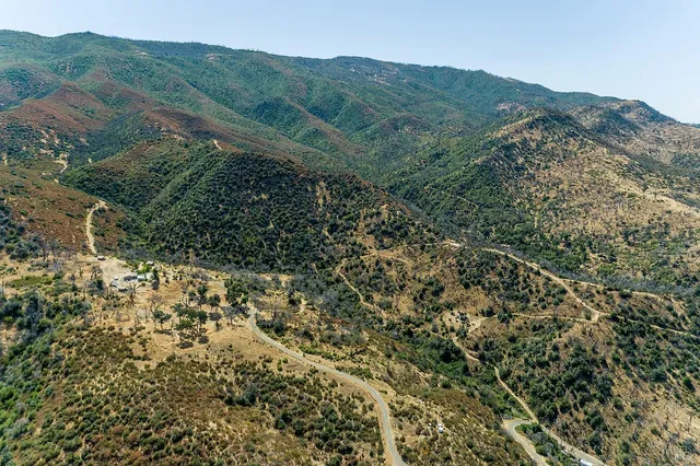 a view of a large building with a mountain in the background