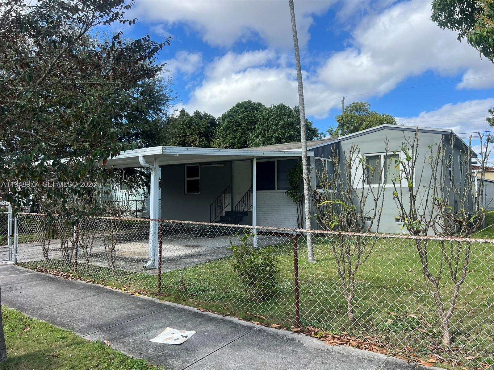 5561 Southwest 5th Terrace Miami, FL 33134 - Photo 2 of 39 a front view of a house with a yard