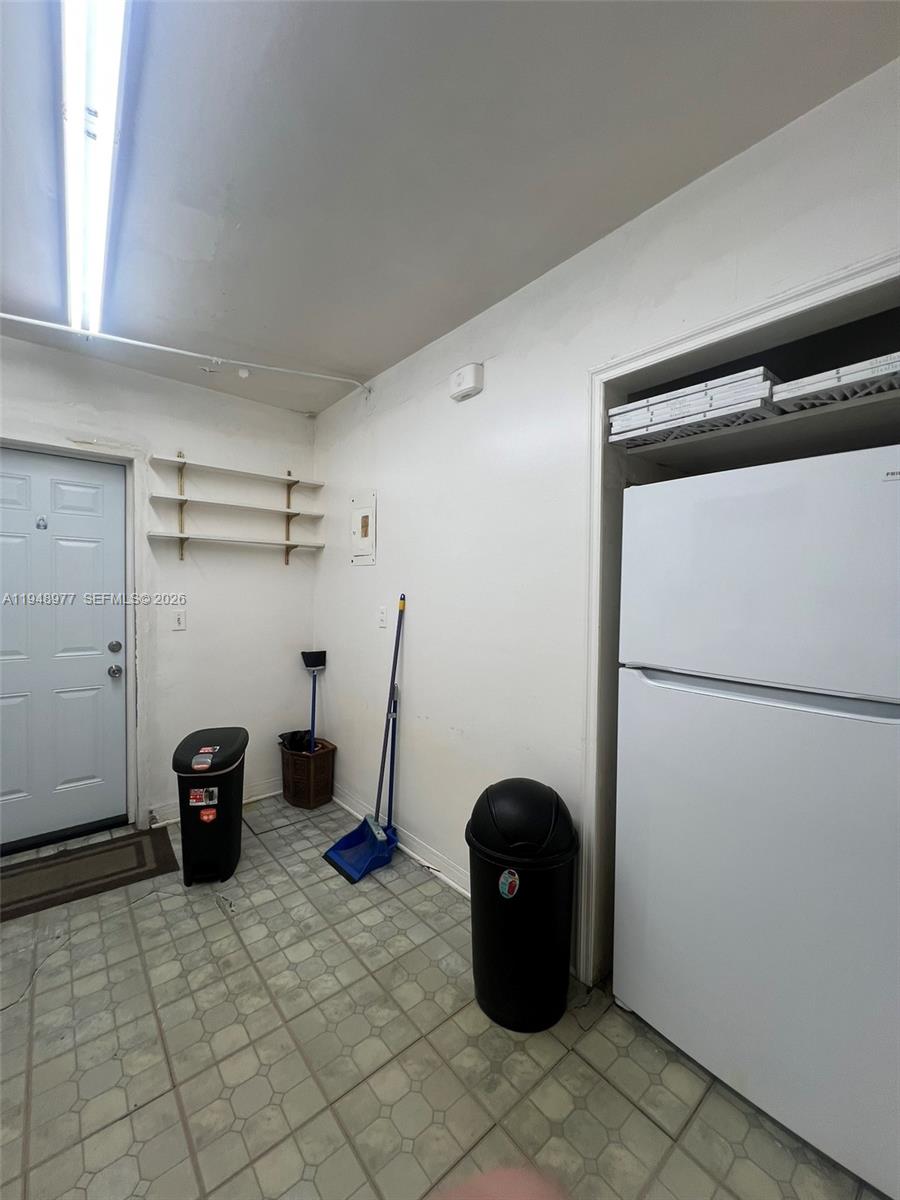5561 Southwest 5th Terrace Miami, FL 33134 - Photo 28 of 39 a view of a storage and utility room with refrigerator