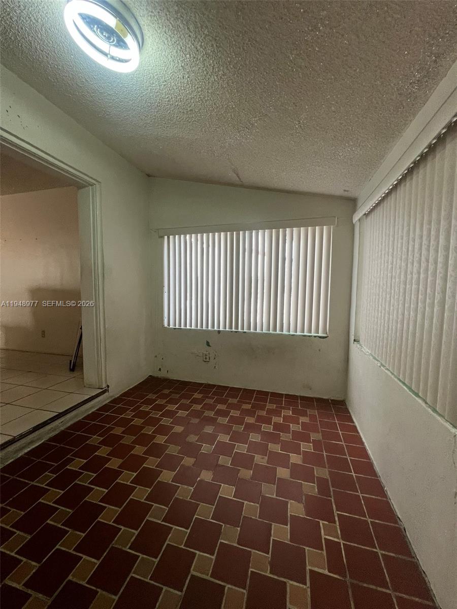 5561 Southwest 5th Terrace Miami, FL 33134 - Photo 30 of 39 a view of an empty room and a window