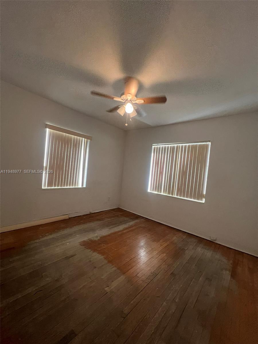 5561 Southwest 5th Terrace Miami, FL 33134 - Photo 32 of 39 a view of an empty room with windows