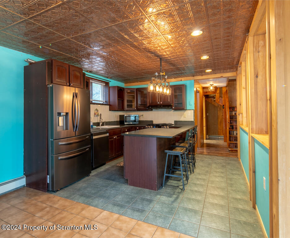 106 Rim Rock Road Milford, PA 18337 - Photo 14 of 32 a kitchen with refrigerator and cabinets