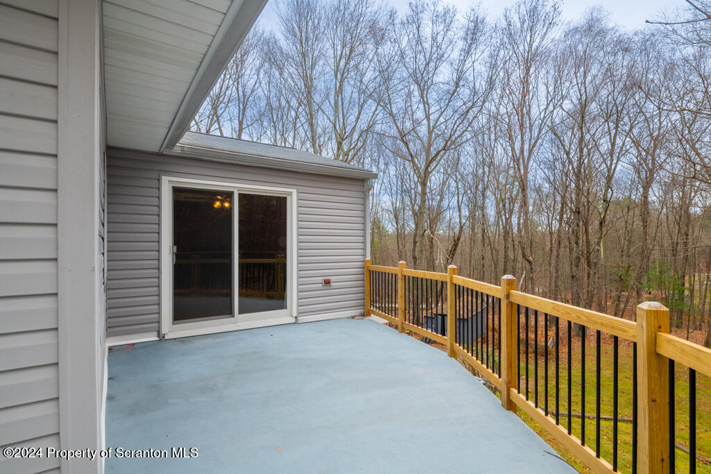 106 Rim Rock Road Milford, PA 18337 - Photo 24 of 32 a view of a house with a wooden fence