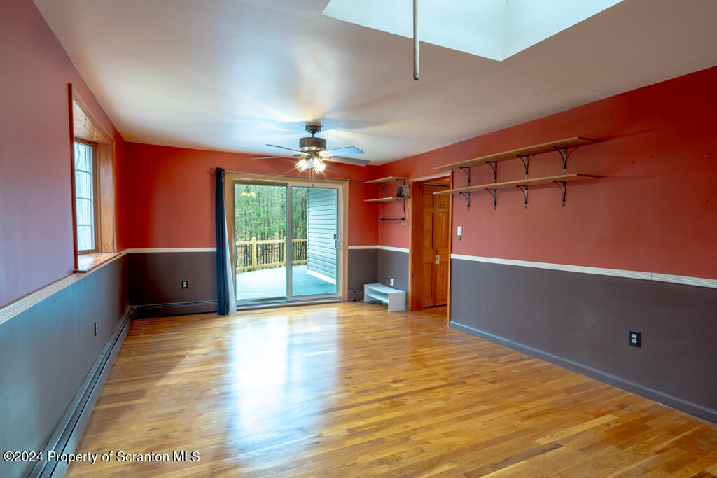 106 Rim Rock Road Milford, PA 18337 - Photo 27 of 32 a view of a room with wooden floor fan and windows