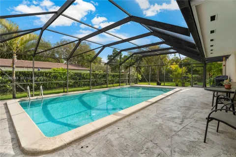 a view of a backyard with sitting area