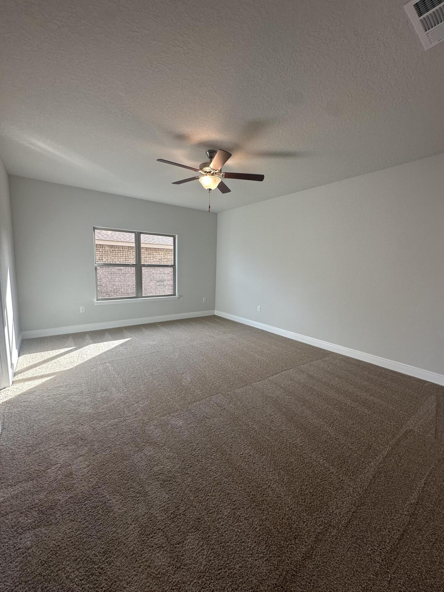 193 Ridgeway Circle Crestview, FL 32536 - Photo 13 of 33 a view of a livingroom with a ceiling fan and window
