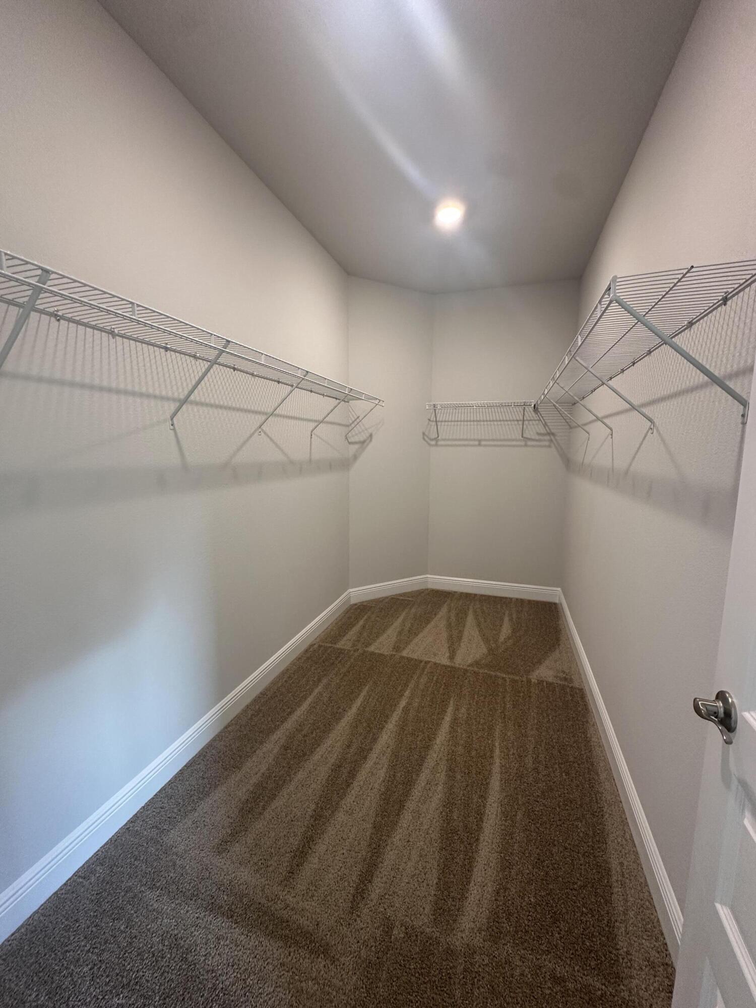 193 Ridgeway Circle Crestview, FL 32536 - Photo 14 of 33 a view of a room with racks on the wall