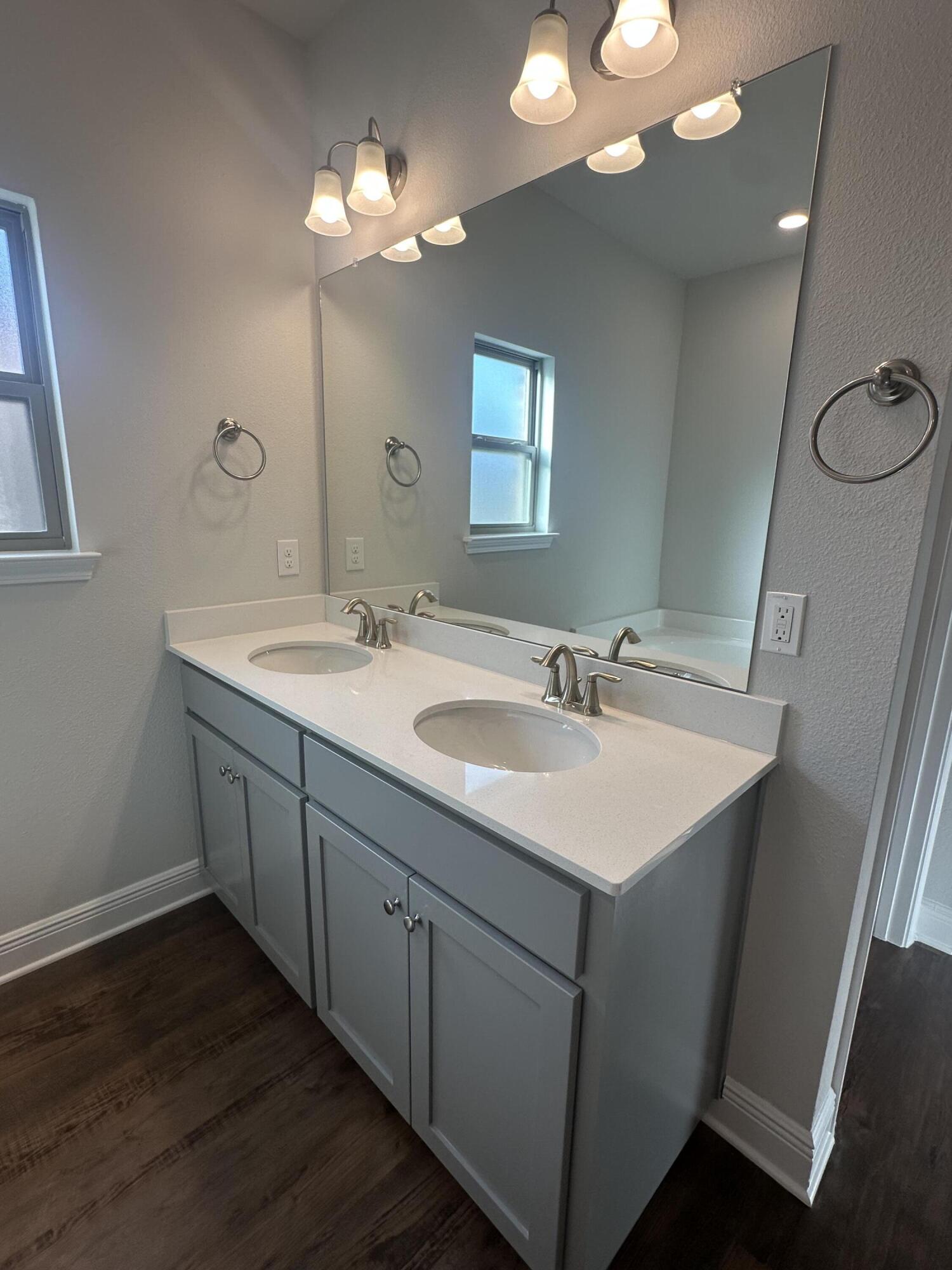 193 Ridgeway Circle Crestview, FL 32536 - Photo 15 of 33 a bathroom with a sink double vanity and a mirror