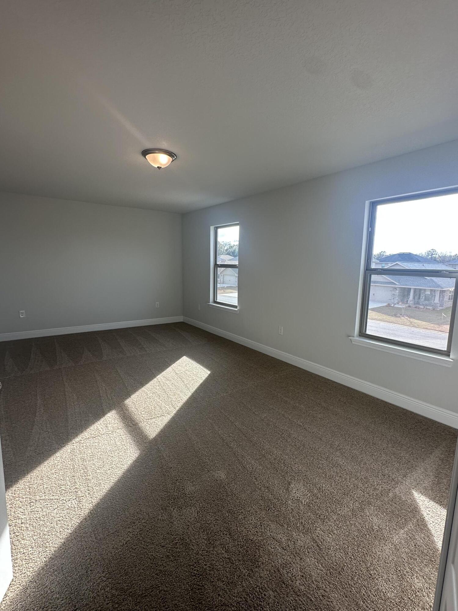 193 Ridgeway Circle Crestview, FL 32536 - Photo 21 of 33 an empty room with windows