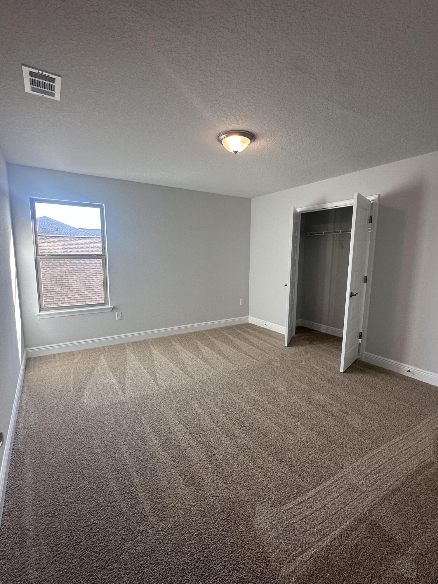 193 Ridgeway Circle Crestview, FL 32536 - Photo 22 of 33 an empty room with a natural light
